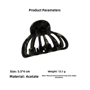 Detail view of acetate tortoise shell hair claw clip with size dimensions 5.5x4cm