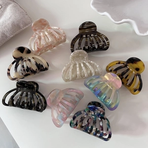 Set of 9 French acetate shell hair claws in tortoiseshell and marble patterns