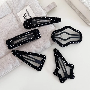 Five-piece set of black and white polka dot fabric hair clips in various geometric shapes