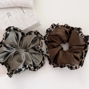 Leopard print satin scrunchies set in brown and grey green for elegant hairstyles