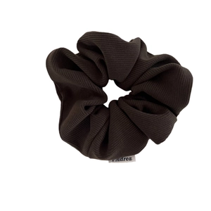 Premium corduroy texture scrunchie in deep charcoal color for elegant hairstyles