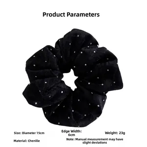 Detail view of large polka dot scrunchie made of soft chenille fabric with size specs