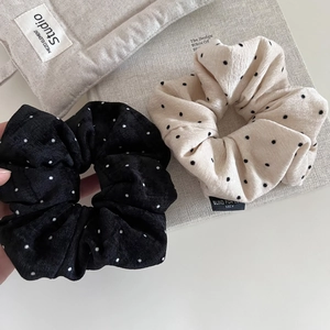 Polka dot plush scrunchies in black and beige, corduroy texture for hair styling