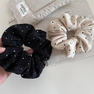 Plush polka dot scrunchie set in soft corduroy fabric for elegant hairstyles