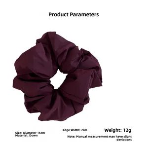 Detail view of burgundy puffy oversized scrunchie showing 16cm diameter dimensions