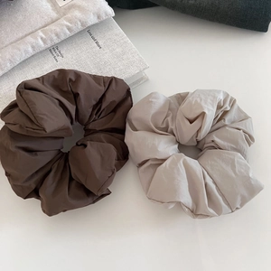 Minimalist puffer scrunchie set in brown and beige colors with a matte pleated texture