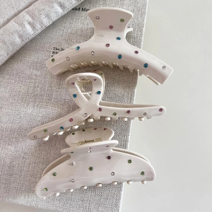 Three-piece set of cream resin hair claws with colorful rhinestones in various shapes