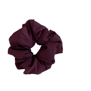 Elegant deep purple scrunchie with padded cloud-like texture for vintage ponytail hairstyles