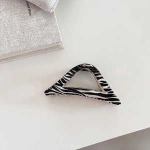 Large zebra print triangle hair claw clip for women with minimalist geometric cutout design