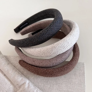 Thick wool sponge headbands in dark grey, cream, purple, and brown woven fabrics