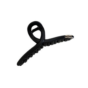 Matte black claw clip featuring Barrette La France gold script and elegant twisted design