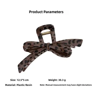 Detail view of leopard print hair claw clip measuring 12.5cm by 5cm for hair styling