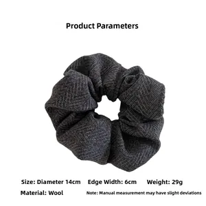 Detail of wool scrunchie with herringbone texture showing 14cm diameter and 6cm width