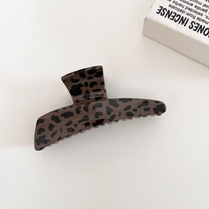 Classic leopard print hair claw clip in dark brown acrylic for elegant updo styling