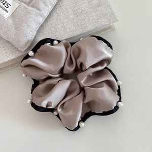 Champagne satin hair scrunchie with black trim and white pearls for stylish ponytails