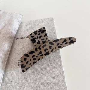 Minimalist leopard print large hair claw clip on a book, vintage hair accessory for women