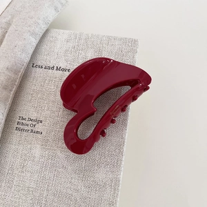 Glossy burgundy acetate hair claw clip with gold lettering for elegant French style hairstyles