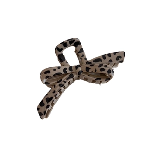 Vintage leopard print hair claw clip in a beige butterfly design for elegant updos