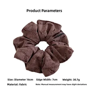 Detail view of brown large scrunchie with 16cm diameter and 7cm width dimensions