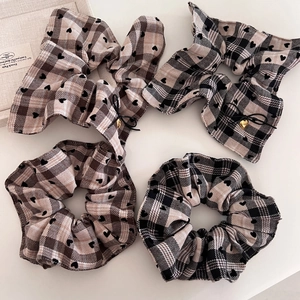 Plaid scrunchie set with heart prints and metallic charms in French minimalist style