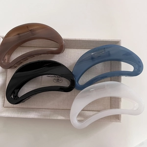 French vintage tortoiseshell crescent claw clips in four assorted colors on a tray