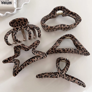 Set of five vintage leopard print hair claws in various geometric shapes for women