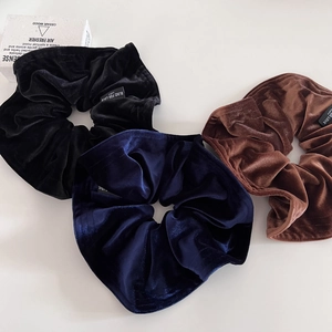 Vintage velvet hair scrunchies in black, navy, and burgundy on a clean white background