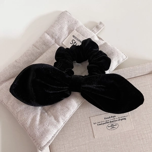 Elegant black velvet bow scrunchie for women with high-quality matte finish