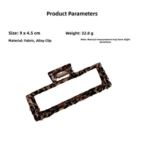 Detail view showing large leopard print hair claw clip size 9x4.5cm and 32.8g weight