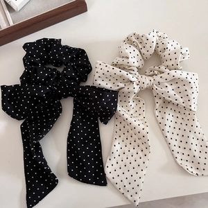 Eleganti elastici per capelli con fiocchi e lunghi nastri a pois in bianco e nero