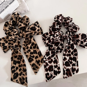 Set of two leopard print bow hair scrunchies with long ribbons in silky satin fabric