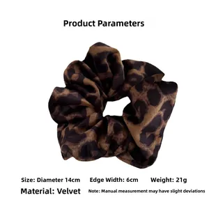 Macro detail of leopard print velvet hair scrunchie showing 14cm diameter and soft texture