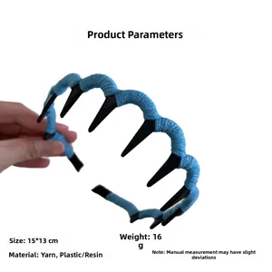 Detail view of the sky blue wool knitted headband with non-slip plastic inner teeth