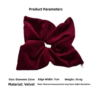 Detail showing oversized burgundy velvet scrunchie dimensions 25cm with soft texture