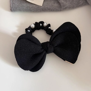 Elegant large black bow hair tie with white pearls and matte fabric finish