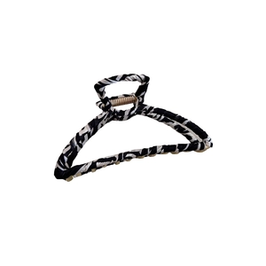 Chic black and white zebra pattern hair claw clip with golden metal frame for women