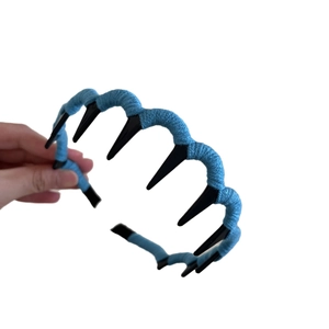 Toothed wave headband wrapped in blue wool yarn for high skull top hair styling