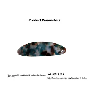 Detail view of 7.5cm acetate oval hair clip with blue marble pattern and alloy spring clip