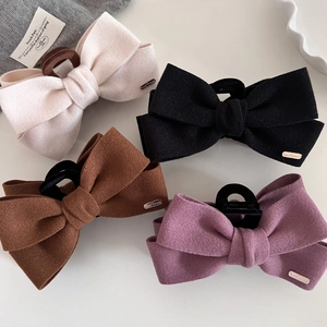 Large wool bow hair claw clips with gold metal label in white black brown and purple