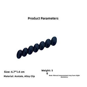 Detail view of oval acetate hair clip in dark blue showing dimensions 6.7x1.4cm