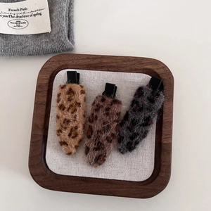 Three-piece set of leopard print faux fur hair clips in brown and grey woolly textures