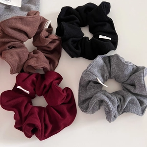 Soft knitted ribbed scrunchies in brown, black, burgundy and grey with handmade label