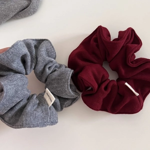 Set of two knit scrunchies in dark grey and burgundy with handmade fabric labels