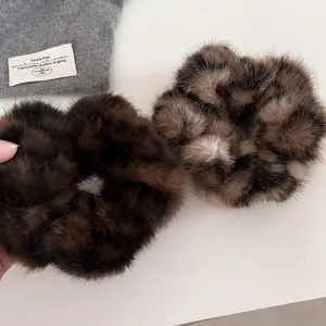 Faux mink fur leopard print and dark brown hair scrunchies for winter hairstyles
