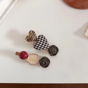 Detail of vintage French style hair clips featuring houndstooth heart and resin beads