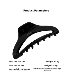 Detail of black acetate hair claw clip showing glossy finish and size specifications