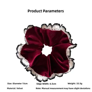 Detail view of red velvet scrunchie with lace edges showing 15cm diameter size