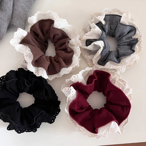 Set of four vintage lace-trimmed fabric hair scrunchies in brown, grey, black, and maroon