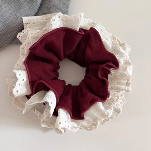Vintage lace scrunchie in burgundy and white, layered fabric for elegant ponytails