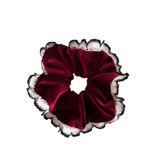 Vintage burgundy velvet hair scrunchie with white lace trim for elegant ponytails